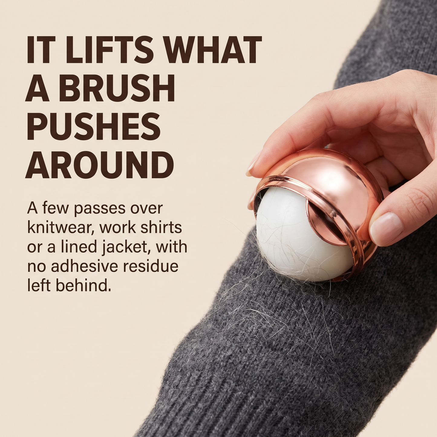 The lint remover ball lifting fine pet hair off a grey wool knit sleeve